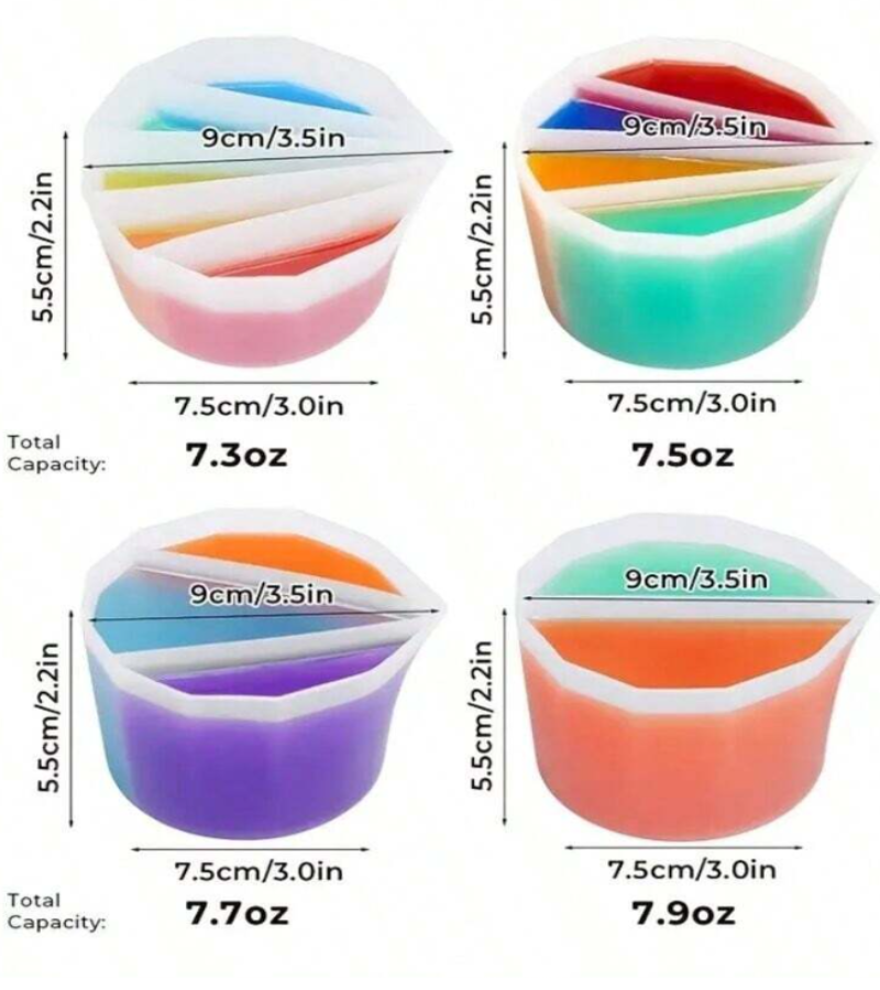 Four small translucent silicone measuring cups on a white background