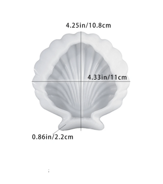 A white scallop shell-shaped item shown on a plain white background with overlaid dimension lines and text indicating measurements of 4.25 in / 10.