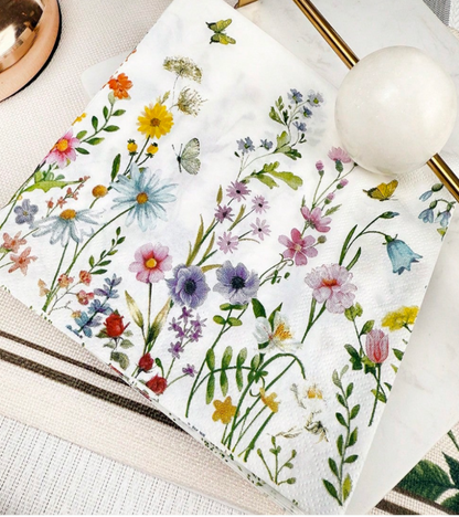 A white decoupage paper with a colorful wildflower and butterfly print