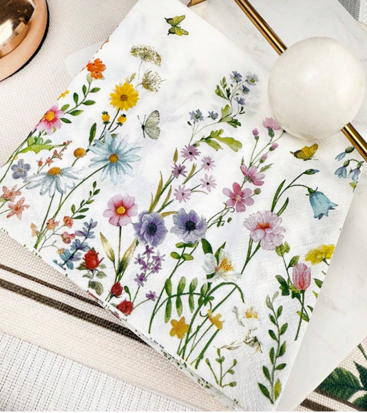 A white decoupage paper with a colorful wildflower and butterfly print