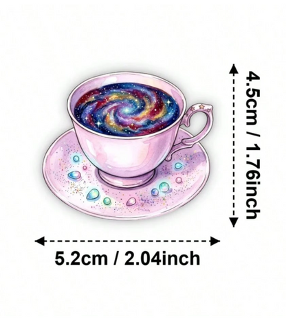 A pink teacup and saucer sticker with a galaxy swirl inside the cup, shown with dimension arrows with measurements.
