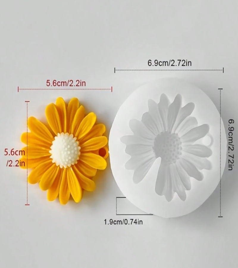 A daisy-shaped yellow flower next to a white silicone mold , with dimension lines.