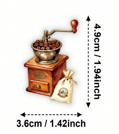 A hand-crank coffee grinder with roasted coffee beans in a metal bowl.